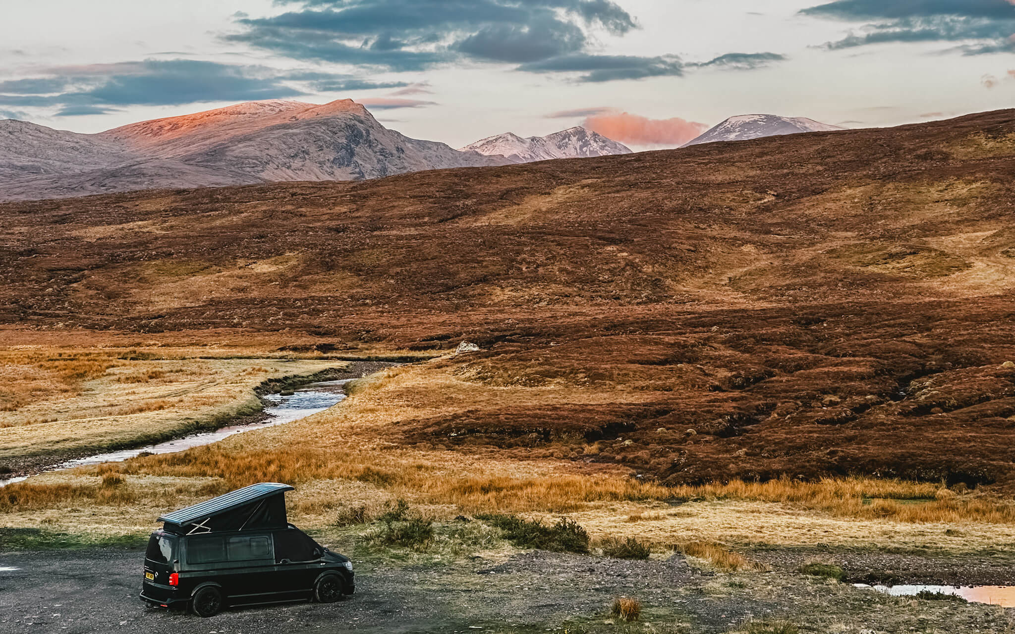 Campervan with mountains in background